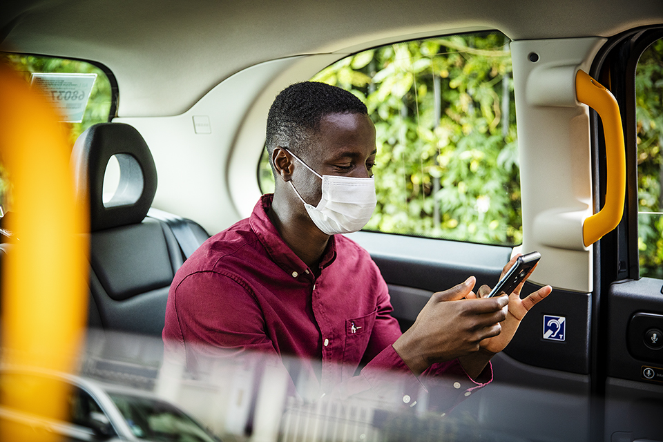 customer-in-taxi-with-mask-by-london-lifestyle-photographer
