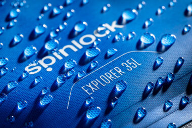 Water droplet studio photography of the Spinlock Explorer bag.