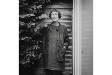 A black and white portrait of the artist Cornelia Parker at her home in London