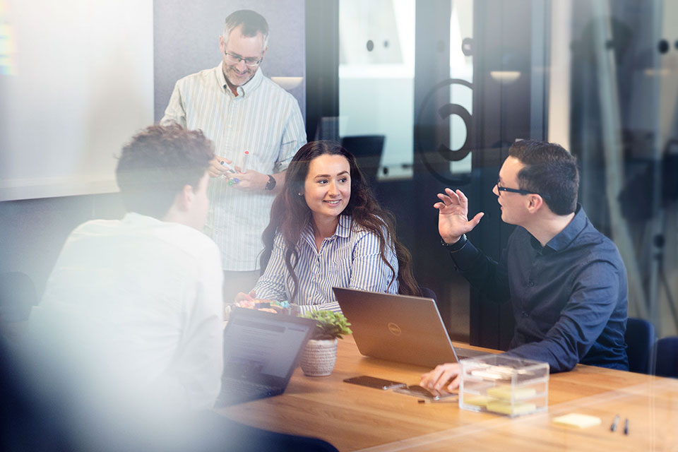 A team meeting photographed by Corporate photographer Richard Boll.