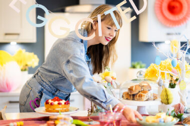 Lifestyle photograph of a woman preparing a table for Easter by Richard Boll.