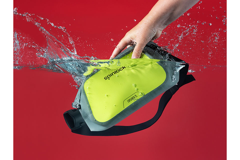 Spinlock waist bag being plunged into water with splash taken by London product photographer Richard Boll.