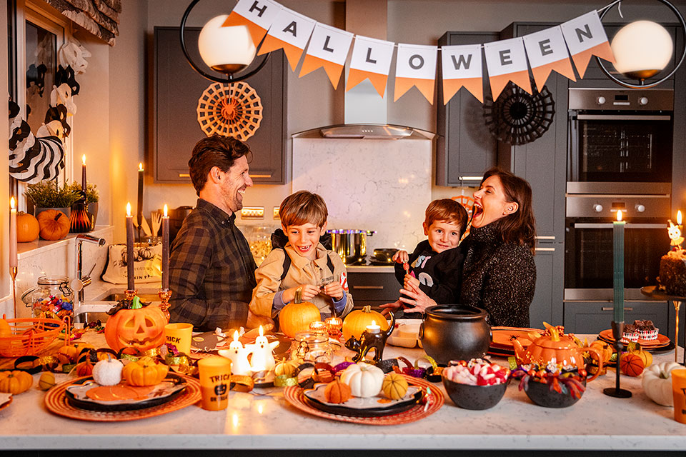 Lifestyle photography of a family enjoying a Halloween party. Richard Boll Photography, London.